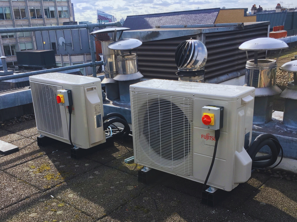 Fujitsu rooftop air conditioning condenser units installed on a commercial building